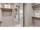 Walk-in closet with custom shelving and hanging space at 10222 E Southwind Ln # 1066, Scottsdale, AZ 85262