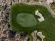 Aerial of green with sand traps and natural desert setting at 10222 E Southwind Ln # 1066, Scottsdale, AZ 85262