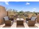 Relaxing patio with seating and fire pit offering scenic views at 10222 E Southwind Ln # 1066, Scottsdale, AZ 85262