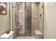 Walk-in shower with glass enclosure and tiled walls at 10222 E Southwind Ln # 1066, Scottsdale, AZ 85262