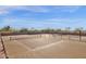 Two tennis courts with surrounding desert landscape at 10222 E Southwind Ln # 1066, Scottsdale, AZ 85262