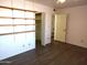 Bedroom with built-in shelving and large closet at 11001 W Connecticut Ave, Sun City, AZ 85351