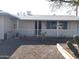 House exterior showcasing a covered entryway and desert landscaping at 11001 W Connecticut Ave, Sun City, AZ 85351