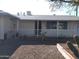 Single story home with covered porch and gravel driveway at 11001 W Connecticut Ave, Sun City, AZ 85351