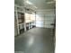 Garage with workbench, shelving, and storage at 11001 W Connecticut Ave, Sun City, AZ 85351