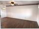 Spacious living room featuring laminate wood floors and a ceiling fan at 11001 W Connecticut Ave, Sun City, AZ 85351