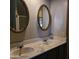 Bathroom with double vanity and ornate mirrors at 11411 N 91St Ave # 80, Peoria, AZ 85345