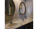 Bathroom with double vanity and ornate mirrors at 11411 N 91St Ave # 80, Peoria, AZ 85345