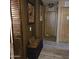 Home hallway with wood-look flooring and wood doors at 11411 N 91St Ave # 80, Peoria, AZ 85345