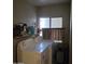 Laundry room with washer, dryer, and shelving at 11411 N 91St Ave # 80, Peoria, AZ 85345