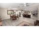 Open dining area with wood table, ornate chairs, and an open flow to the kitchen at 11427 S Tomah St, Phoenix, AZ 85044