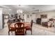 Open dining area with wood table, ornate chairs, and an open flow to the kitchen at 11427 S Tomah St, Phoenix, AZ 85044