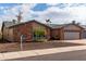 Charming brick and stucco home with a well-manicured front yard and inviting curb appeal at 11427 S Tomah St, Phoenix, AZ 85044