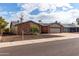 Charming brick and stucco home with a well-manicured front yard and inviting curb appeal at 11427 S Tomah St, Phoenix, AZ 85044