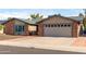 Charming brick and stucco home with a well-manicured front yard and inviting curb appeal at 11427 S Tomah St, Phoenix, AZ 85044