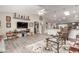 Bright living room featuring a ceiling fan, modern decor, and wood-look flooring at 11427 S Tomah St, Phoenix, AZ 85044