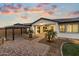 Landscaped backyard with gazebo and pathway at 12528 W Tuckey W Ln, Glendale, AZ 85307