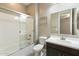 Bathroom with shower/tub combo and dark vanity at 12528 W Tuckey W Ln, Glendale, AZ 85307