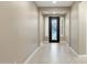 Bright and airy entryway with tile flooring and a grand door at 12528 W Tuckey W Ln, Glendale, AZ 85307