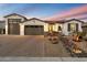 Stunning curb appeal! This home features a two-car garage and beautifully landscaped front yard at 12528 W Tuckey W Ln, Glendale, AZ 85307