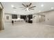 Open concept living area with tile flooring and kitchen views at 12528 W Tuckey W Ln, Glendale, AZ 85307