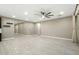 Spacious living room with tile floors and ceiling fan at 12528 W Tuckey W Ln, Glendale, AZ 85307