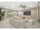 Spacious living room featuring neutral tones, modern decor, and plenty of natural light at 12528 W Tuckey W Ln, Glendale, AZ 85307