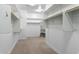 Spacious walk-in closet with ample shelving and hanging rods at 12528 W Tuckey W Ln, Glendale, AZ 85307