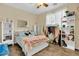 Bedroom with a queen bed, shelving, and clothing rack at 1378 E Madison Dr, Casa Grande, AZ 85122