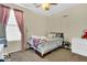 Bright bedroom with window, carpet, and neutral decor at 1378 E Madison Dr, Casa Grande, AZ 85122