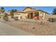 One-story house with a two-car garage and desert landscaping at 1378 E Madison Dr, Casa Grande, AZ 85122