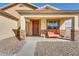 Front porch with a brown bench and stone accents at 1378 E Madison Dr, Casa Grande, AZ 85122