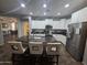 Open concept kitchen featuring an island and stainless steel appliances at 1378 E Madison Dr, Casa Grande, AZ 85122