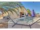 Inviting backyard oasis featuring a pool and hammock at 1378 E Madison Dr, Casa Grande, AZ 85122