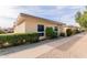 Light-beige condo building with walkway and landscaping at 14017 N 111Th Ave, Sun City, AZ 85351