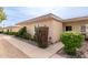 Light-beige condo building with walkway and landscaping at 14017 N 111Th Ave, Sun City, AZ 85351