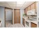 View of kitchen with wood cabinets and granite countertops at 14017 N 111Th Ave, Sun City, AZ 85351