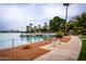 Peaceful lakeside walkway with benches and dock access at 14017 N 111Th Ave, Sun City, AZ 85351