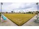 Expansive lawn bowling green with benches at 14017 N 111Th Ave, Sun City, AZ 85351