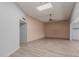 Living room with light wood floors and ceiling fan at 14017 N 111Th Ave, Sun City, AZ 85351