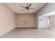 Living room with light wood floors and ceiling fan at 14017 N 111Th Ave, Sun City, AZ 85351