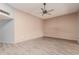 Living room with light wood floors and ceiling fan at 14017 N 111Th Ave, Sun City, AZ 85351