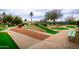 Fun mini golf course with winding pathways and stone features at 14017 N 111Th Ave, Sun City, AZ 85351