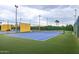 Well-maintained tennis court with green and blue surface at 14017 N 111Th Ave, Sun City, AZ 85351