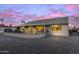 Covered patio with a rock-covered backyard and a sunset view at 15119 W Via Montoya --, Sun City West, AZ 85375