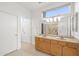 Bathroom with double vanity and large mirror at 15119 W Via Montoya --, Sun City West, AZ 85375