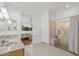 Main bathroom with double vanity and walk-in shower at 15119 W Via Montoya --, Sun City West, AZ 85375