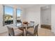 Bright breakfast nook with glass-top table and wicker chairs, adjacent to kitchen at 15119 W Via Montoya --, Sun City West, AZ 85375