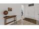 Bright entryway with tile flooring, a console table, and view to the living room at 15119 W Via Montoya --, Sun City West, AZ 85375