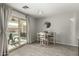 Casual dining area with sliding glass door and pool view at 1615 E Maddison Cir, San Tan Valley, AZ 85140